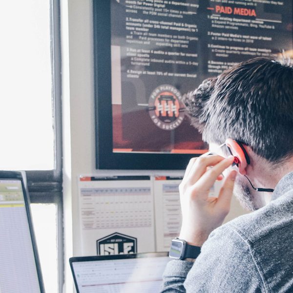 man listening at desk